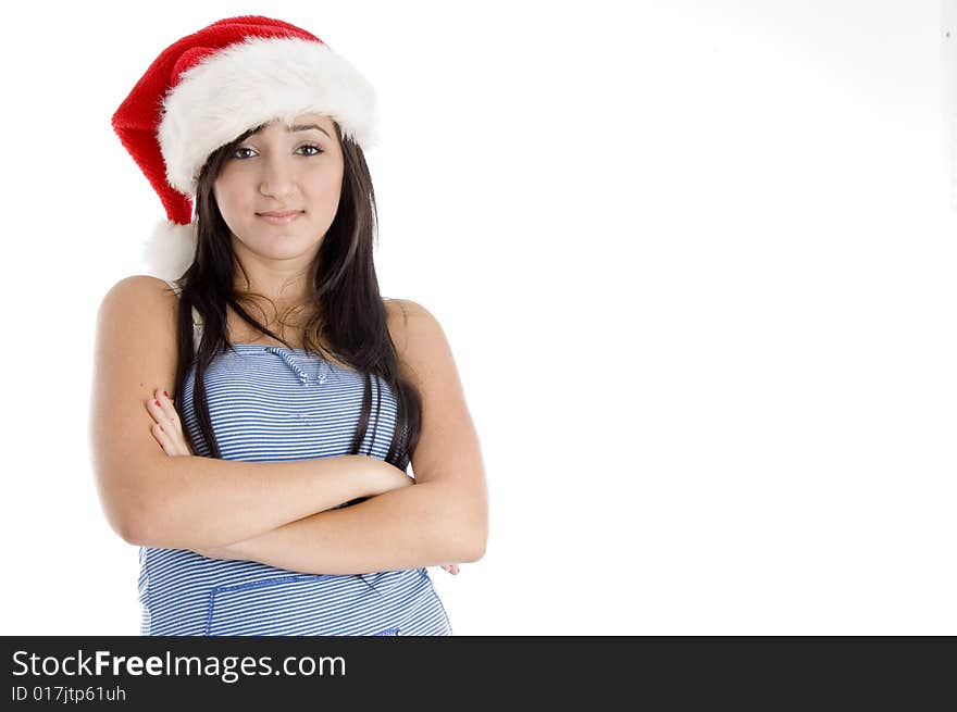 Girl with christmas hat looking at camera on  an isolated white background