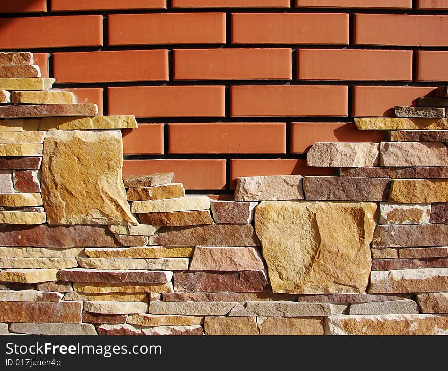 Irregular brick wall with various tint and forms of brick