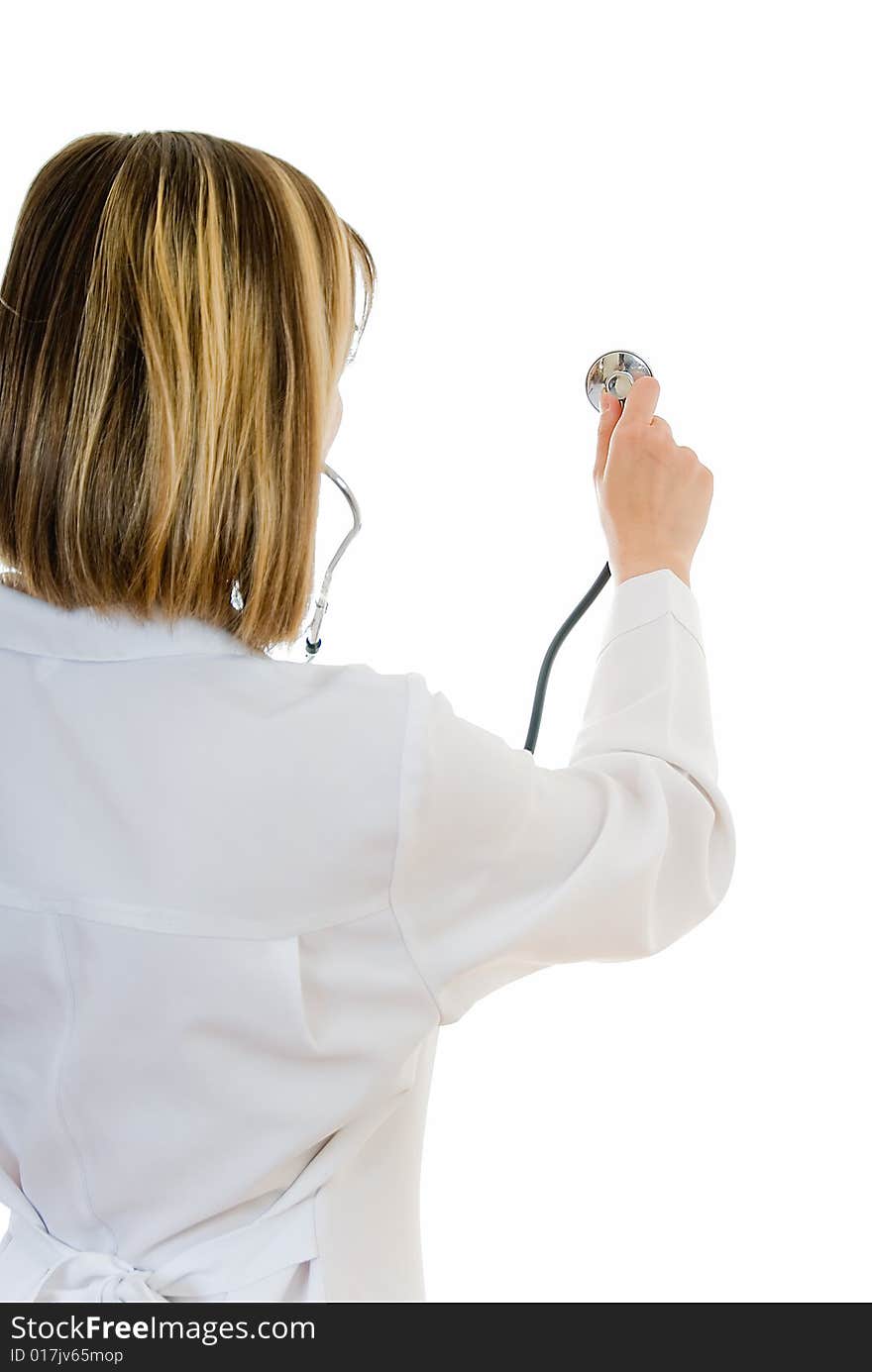 Young woman doctor examines with stethoscope on white. Young woman doctor examines with stethoscope on white