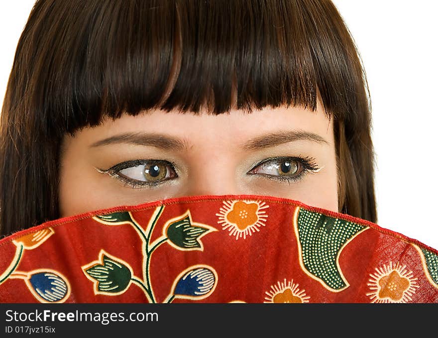 Portrait of young woman who is smiling and closing face with fan. Portrait of young woman who is smiling and closing face with fan