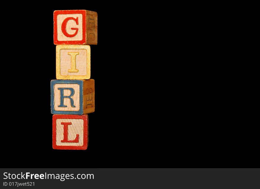 Four wooden baby blocks are stacked up to spell the word Girl with room for copy. Four wooden baby blocks are stacked up to spell the word Girl with room for copy.