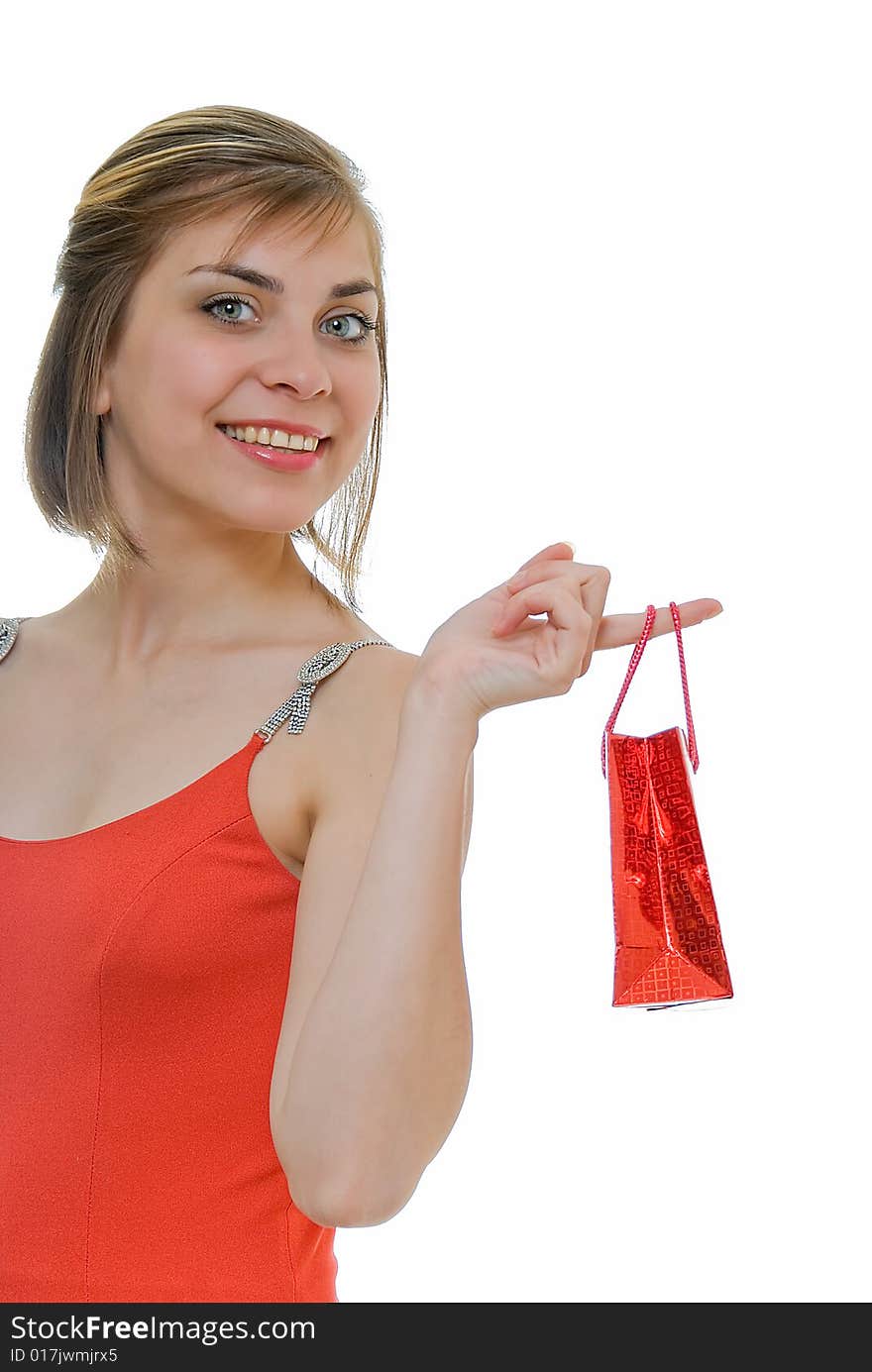 Young woman in red with red gift on white. Young woman in red with red gift on white