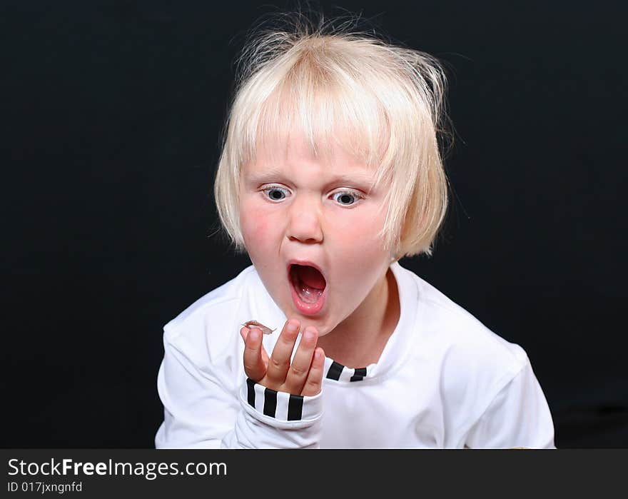 Beautiful little girl with a funny expression on her face. Beautiful little girl with a funny expression on her face