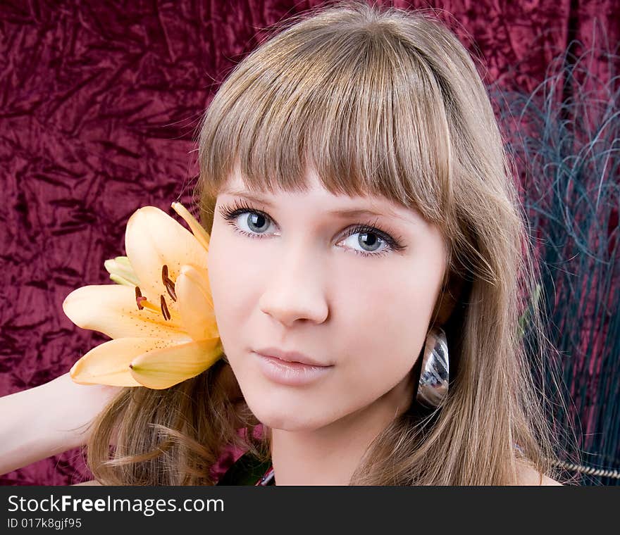 Beautiful angelic woman with a flower