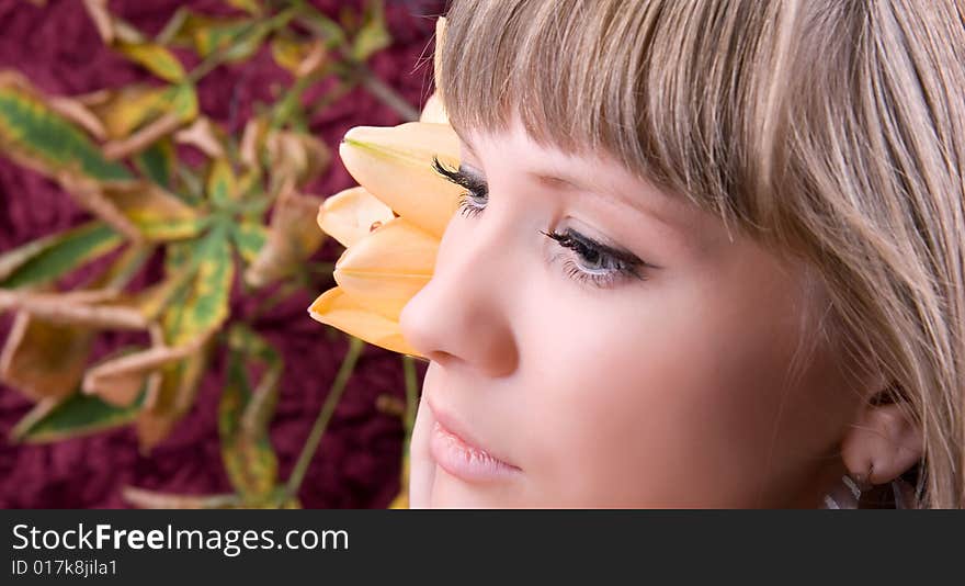 Fashion woman portrait with a beautiful flower