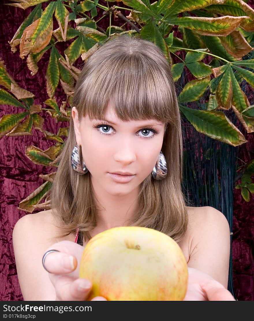 Young woman with fresh apple