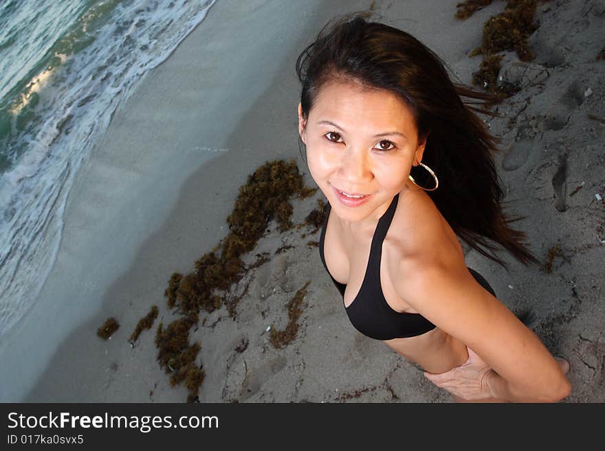 High angle view of a woman smiling up at the camera. High angle view of a woman smiling up at the camera.