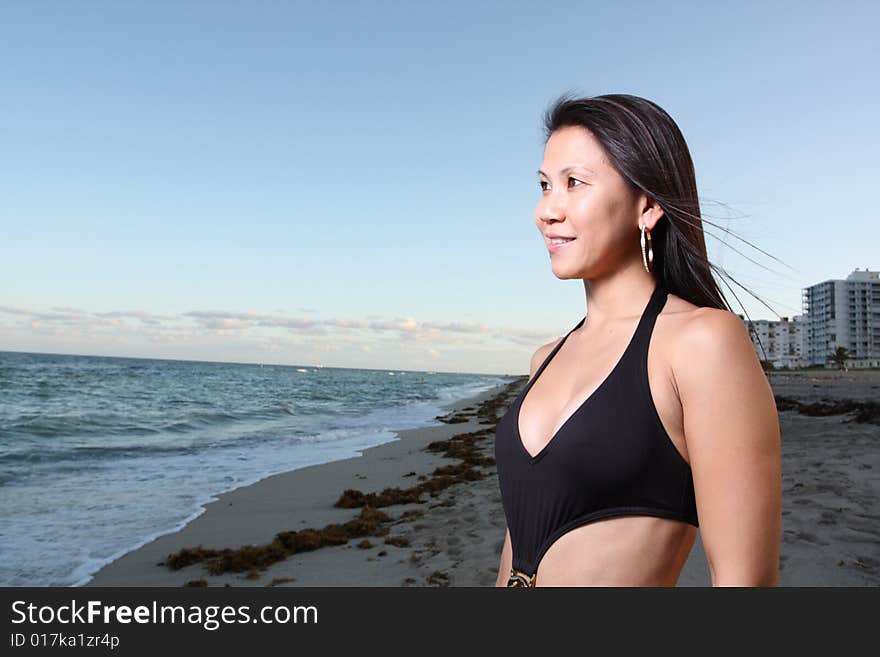 Woman staring at the ocean