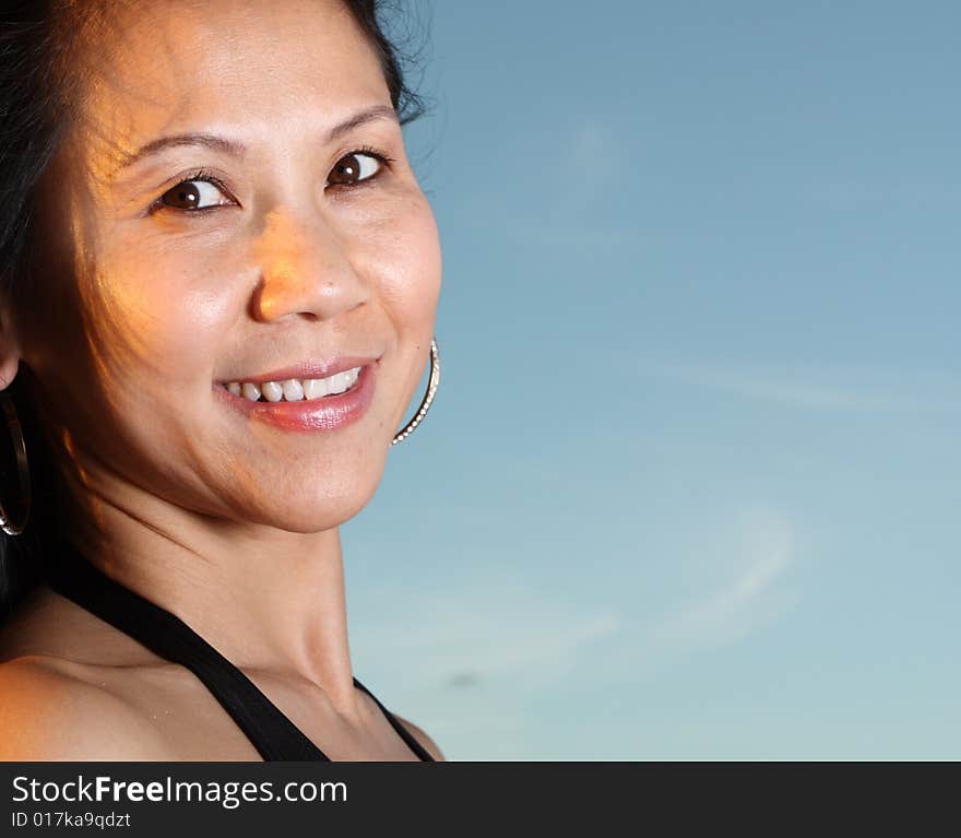 Beautiful young woman smiling at the camera. Beautiful young woman smiling at the camera.