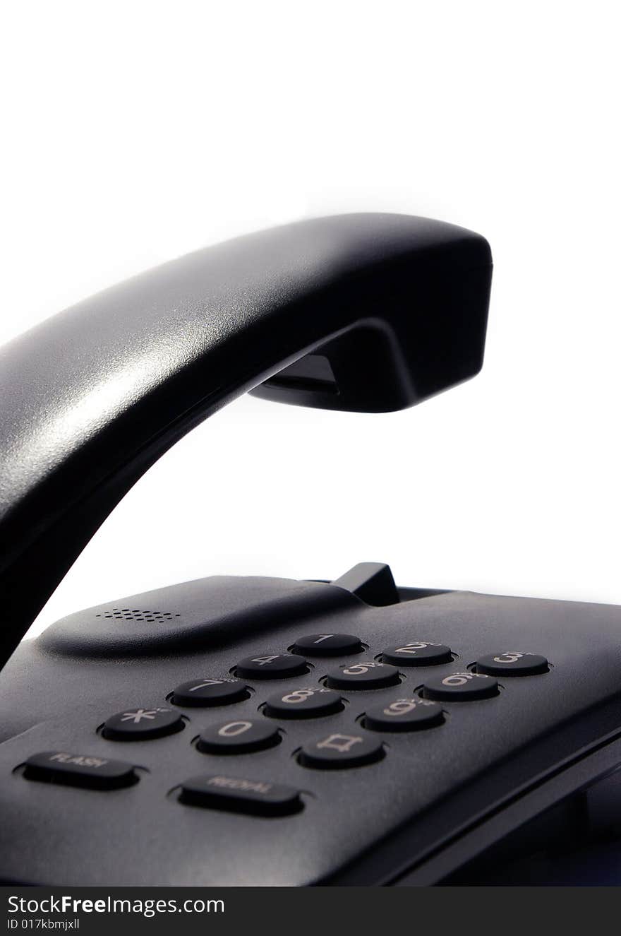 Black telephone on white background