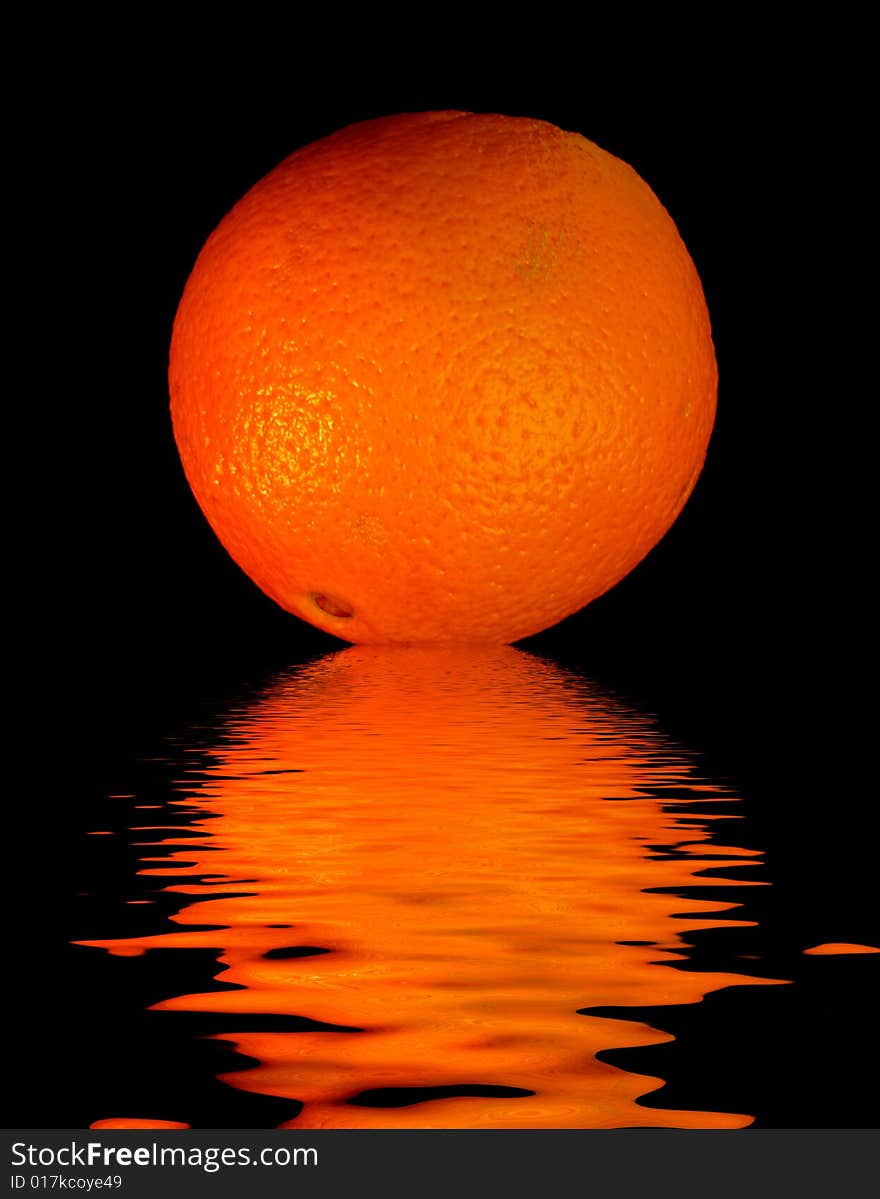 Colored orange -  on black with reflection in water