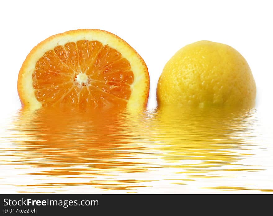 Colored slice of orange and lemon with rough surface in water