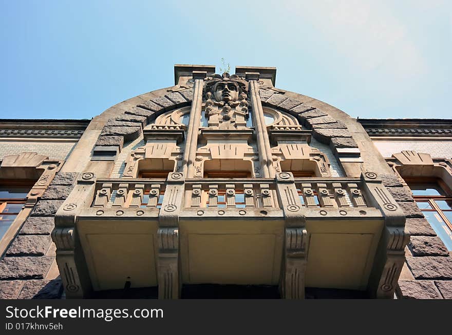 Old house with balcony on facade. Old house with balcony on facade