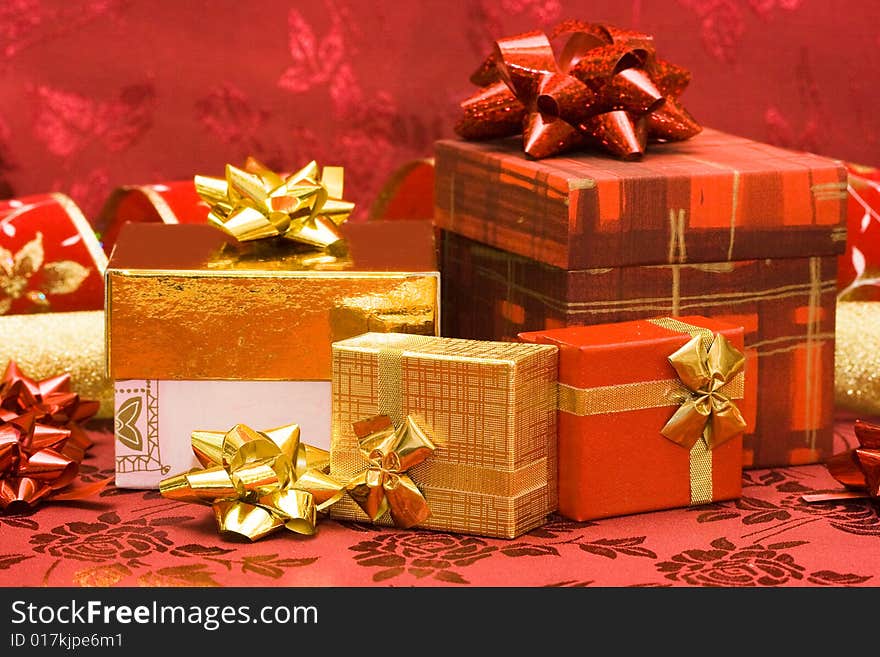 Red and golden gift boxes with bow