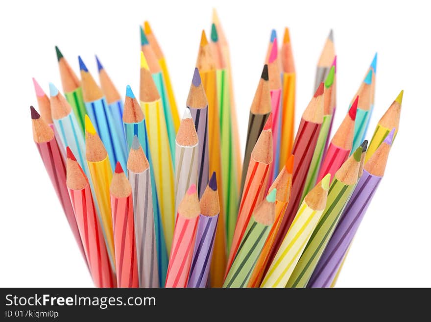 Close up of colorful color pencils over white background.