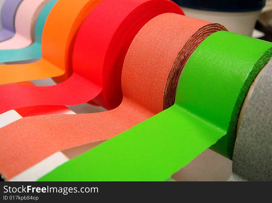 A Rainbow of colored medical/lab tape in a dispenser. A Rainbow of colored medical/lab tape in a dispenser.