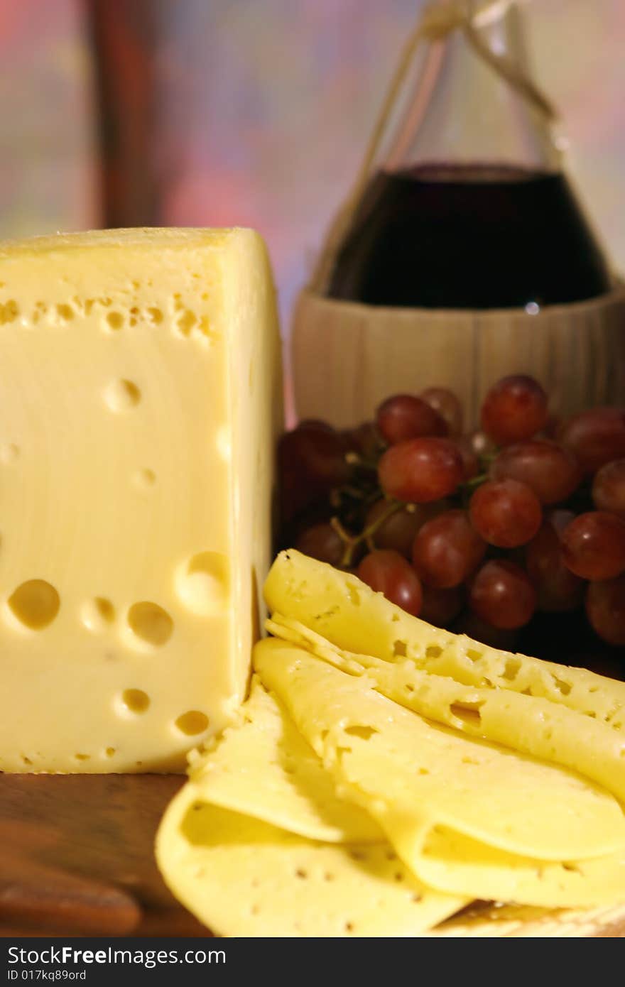 Still-life with cheese, grape and wine.