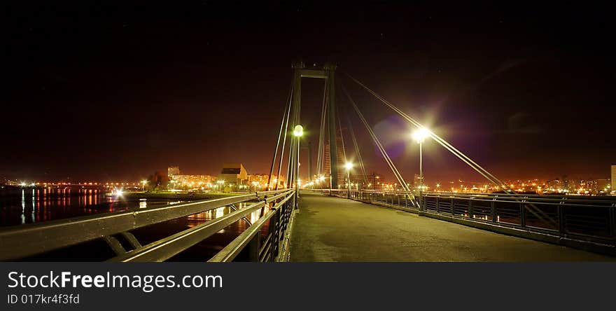 Pendant bridge in Krasnoyarsk at night. Russia, Siberia, Krasnoyarsk. Pendant bridge in Krasnoyarsk at night. Russia, Siberia, Krasnoyarsk