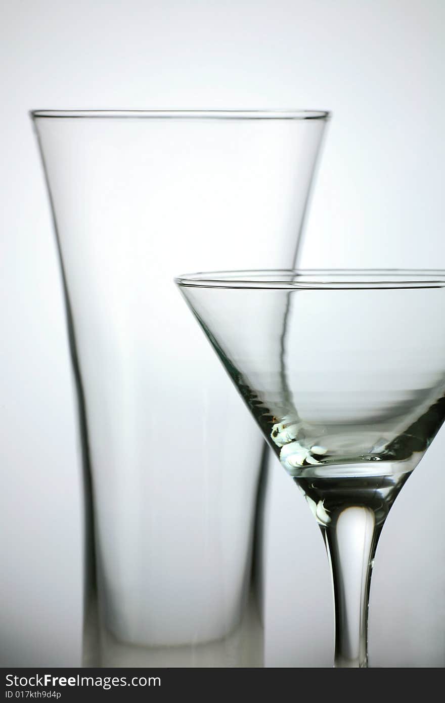 Transparent wine glass on light grey background