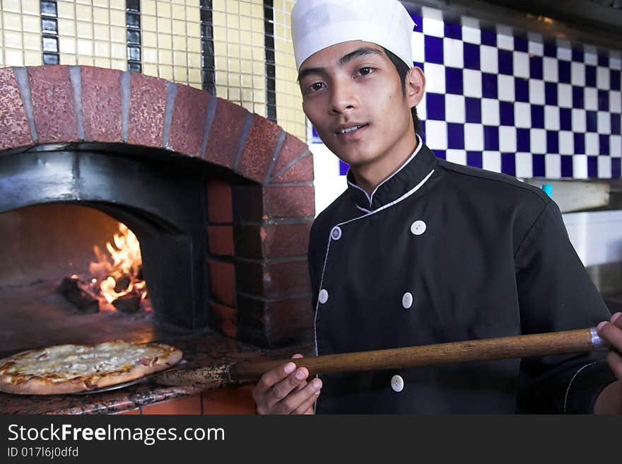 Chef Preparing or cooking pizza food. Chef Preparing or cooking pizza food