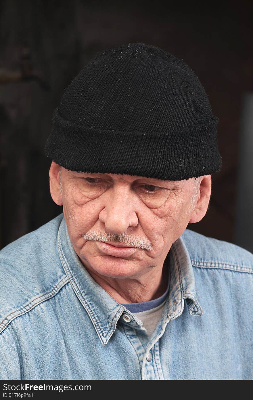 Old man in black hat