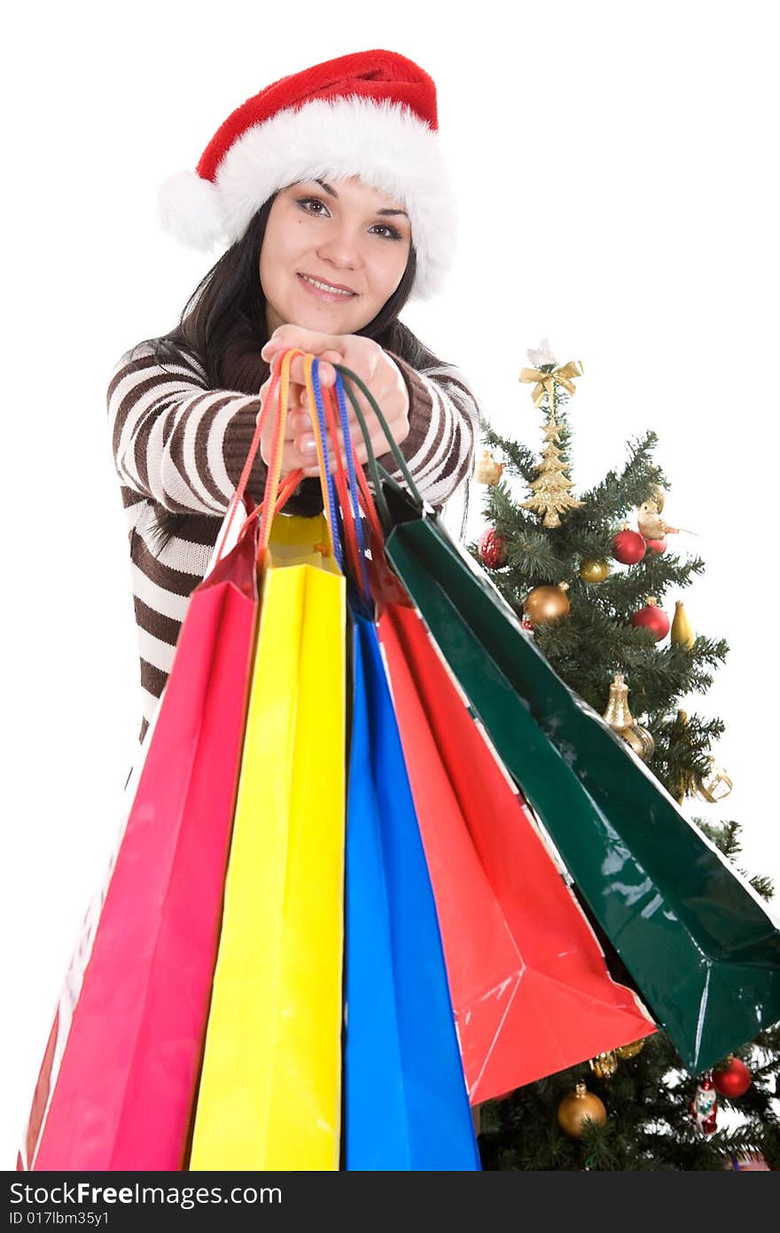 Attractive brunette woman happy over christmas tree. Attractive brunette woman happy over christmas tree