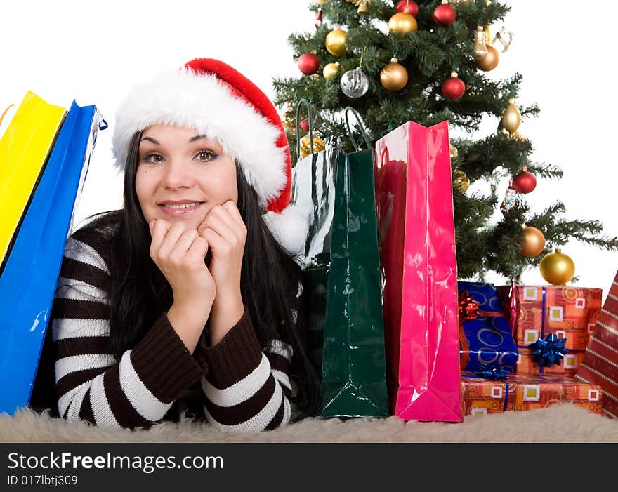 Attractive brunette woman happy over christmas tree. Attractive brunette woman happy over christmas tree