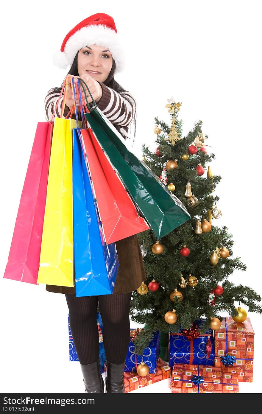 Attractive brunette woman happy over christmas tree. Attractive brunette woman happy over christmas tree