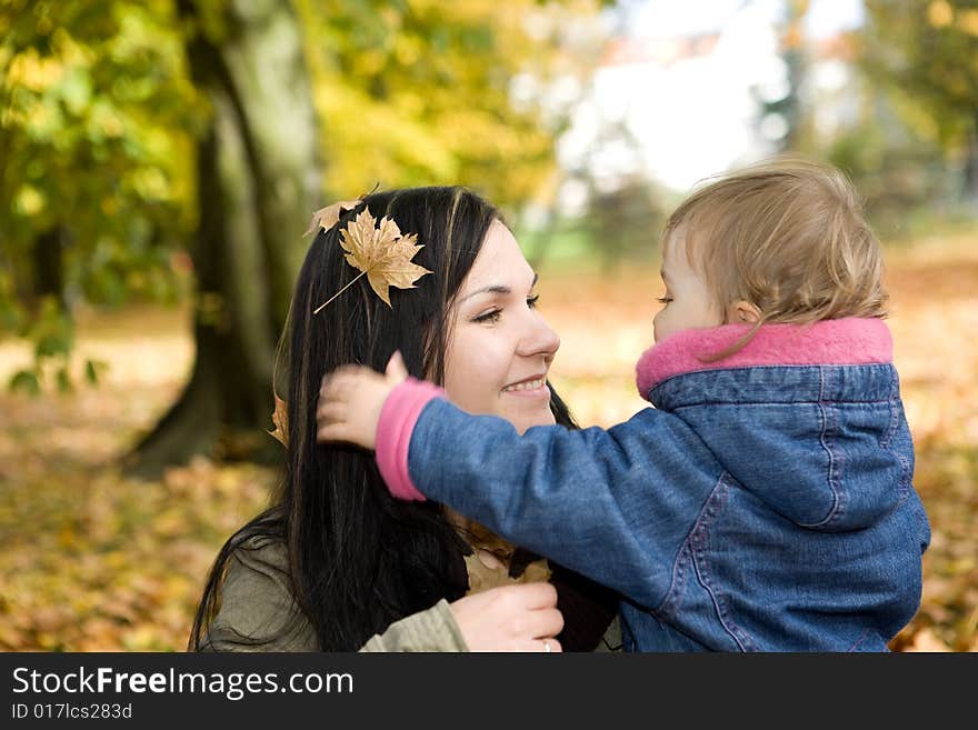 Mother and daughter playing in park. Mother and daughter playing in park