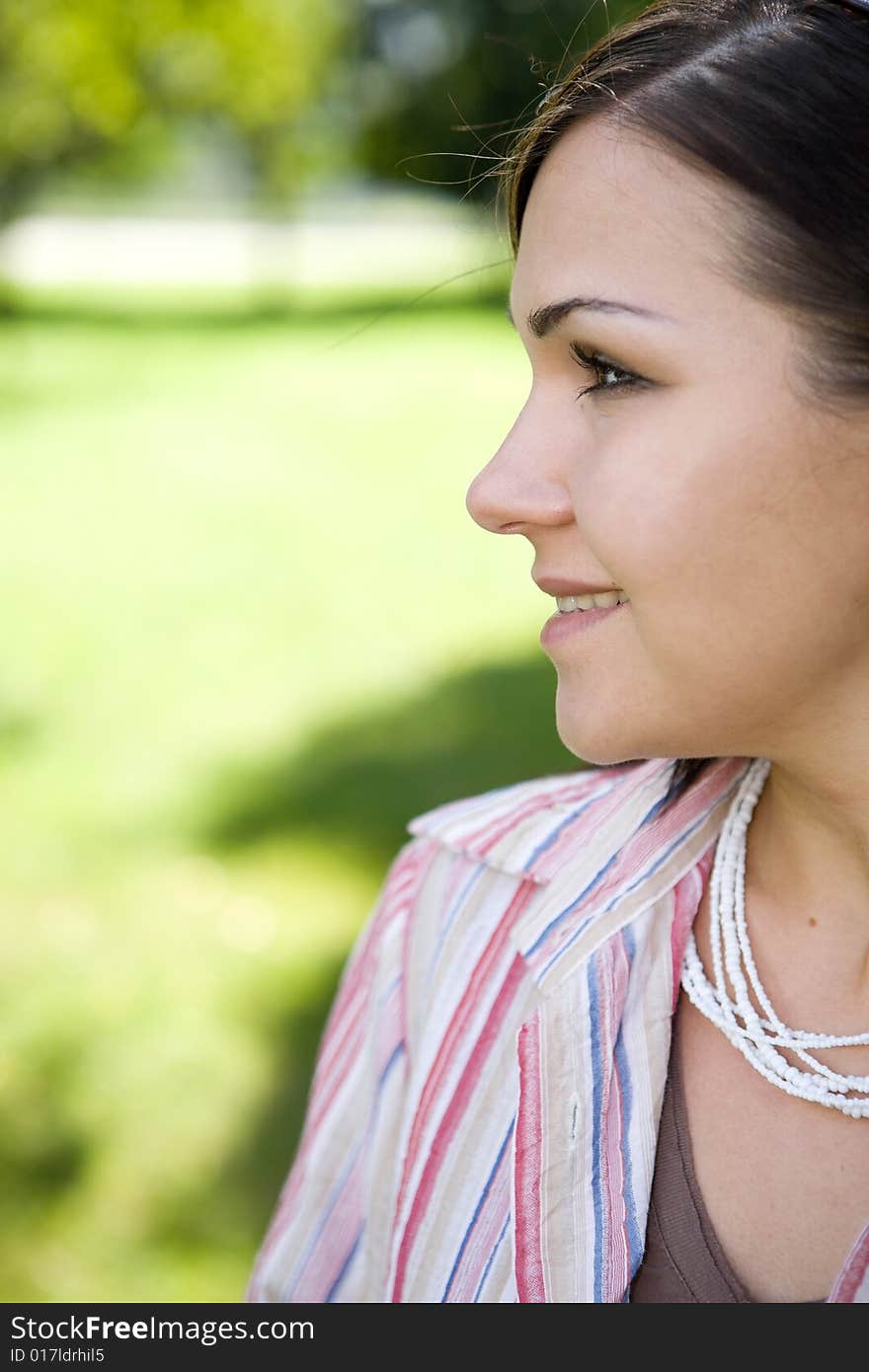 Casual woman relaxing in park. Casual woman relaxing in park