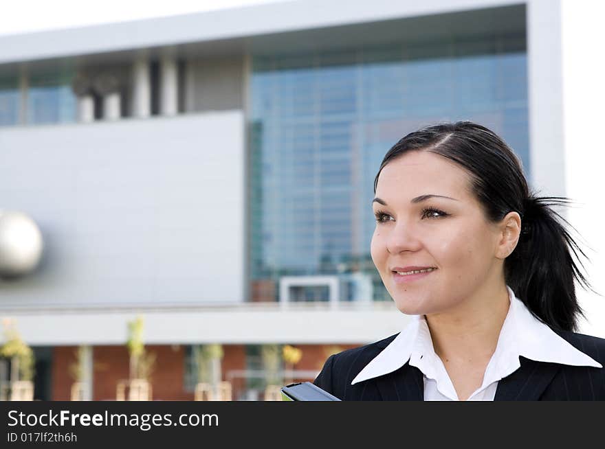 Attractive, successful brunette businesswoman outdoor