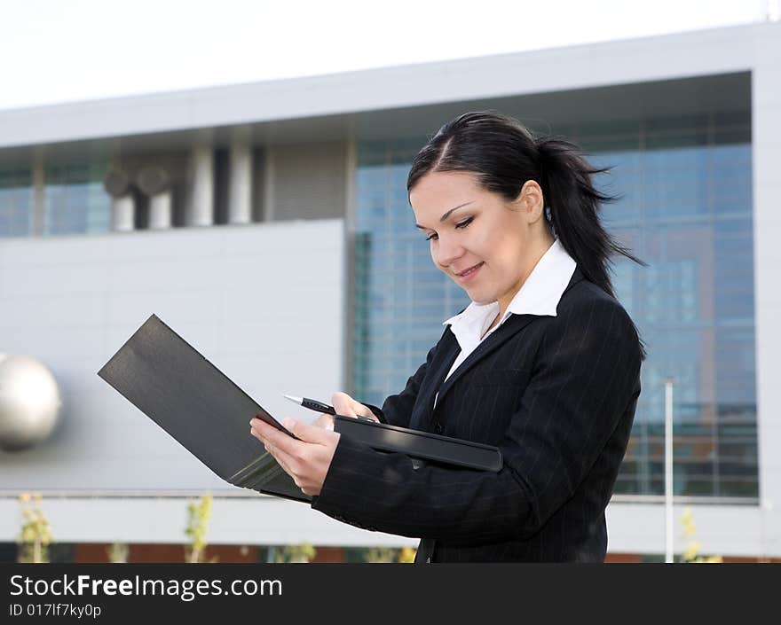 Attractive, successful brunette businesswoman outdoor