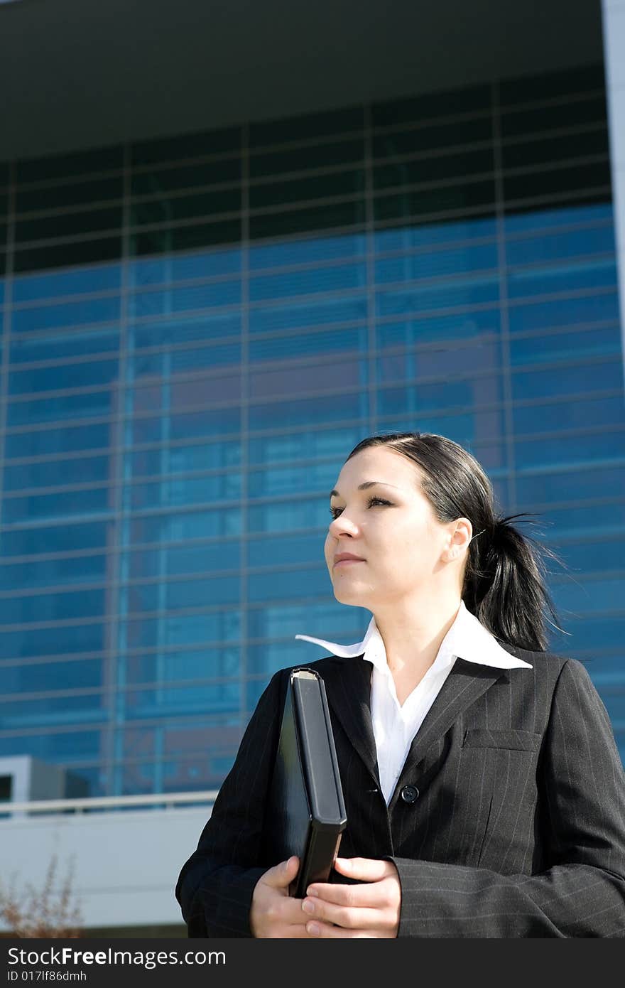 Attractive, successful brunette businesswoman outdoor