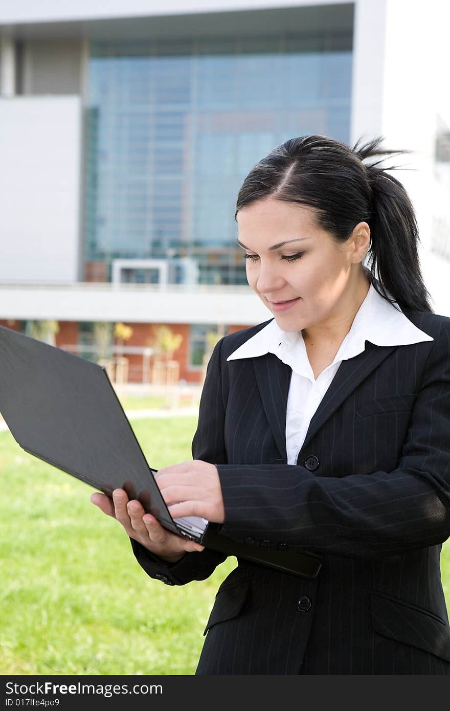 Attractive, successful brunette businesswoman outdoor