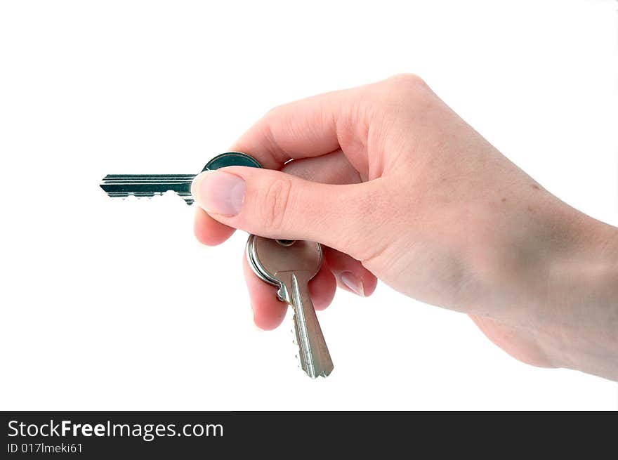 An isolated image of a hand holding keys ready to open a lock. An isolated image of a hand holding keys ready to open a lock