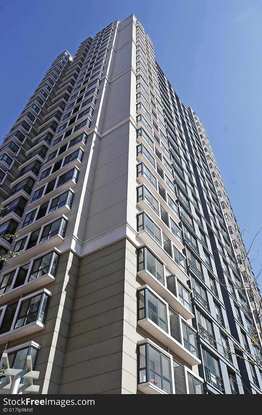 Modern building on a blue sky as background.