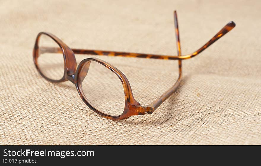 Horn-rimmed glasses on material