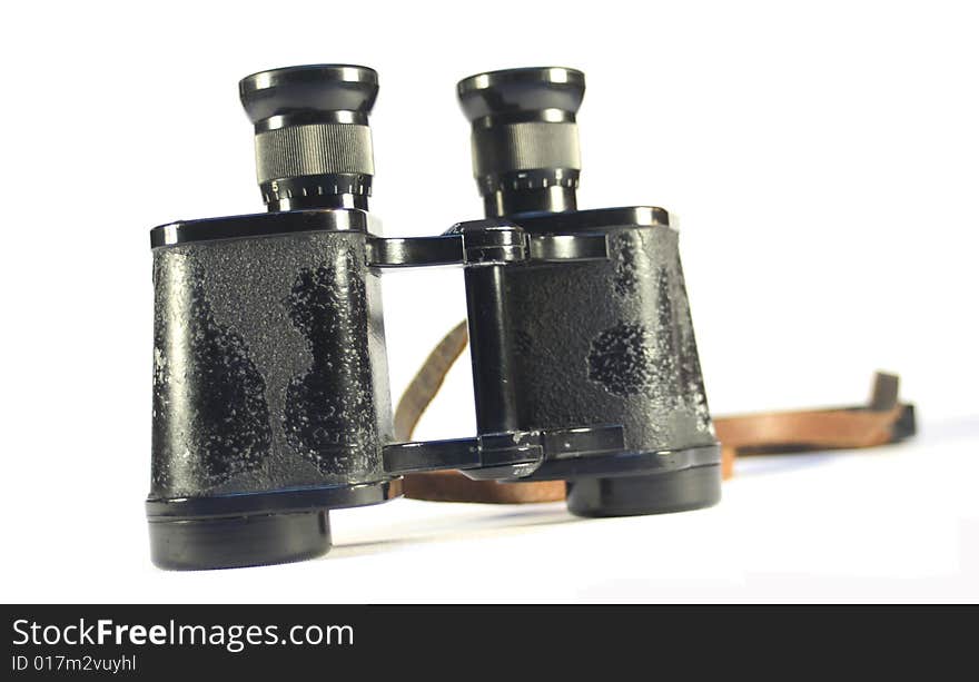 Old binoculars isolated on white