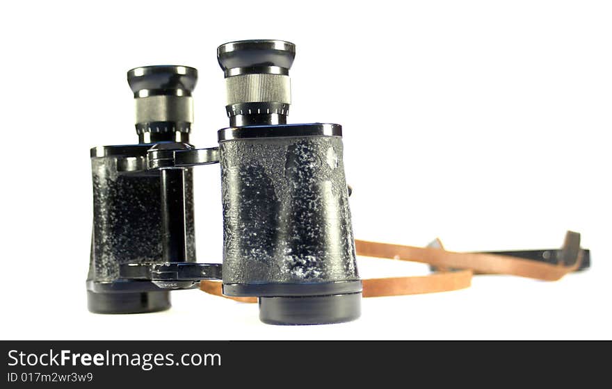 Old binoculars isolated on white