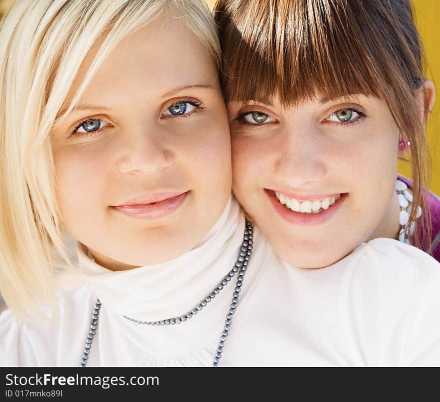 Two smiling girls portrait