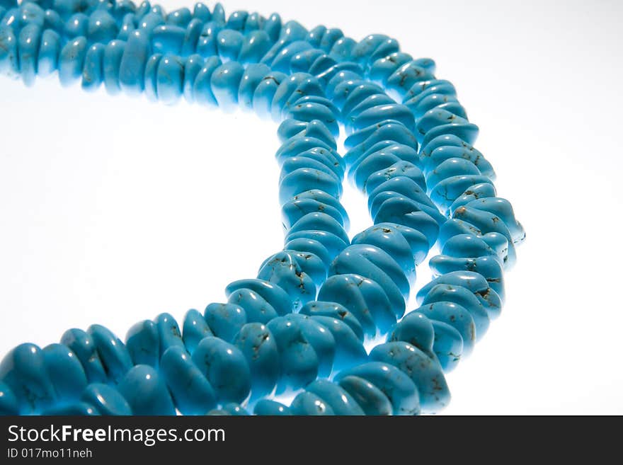 Turquoise beads isolated on white background