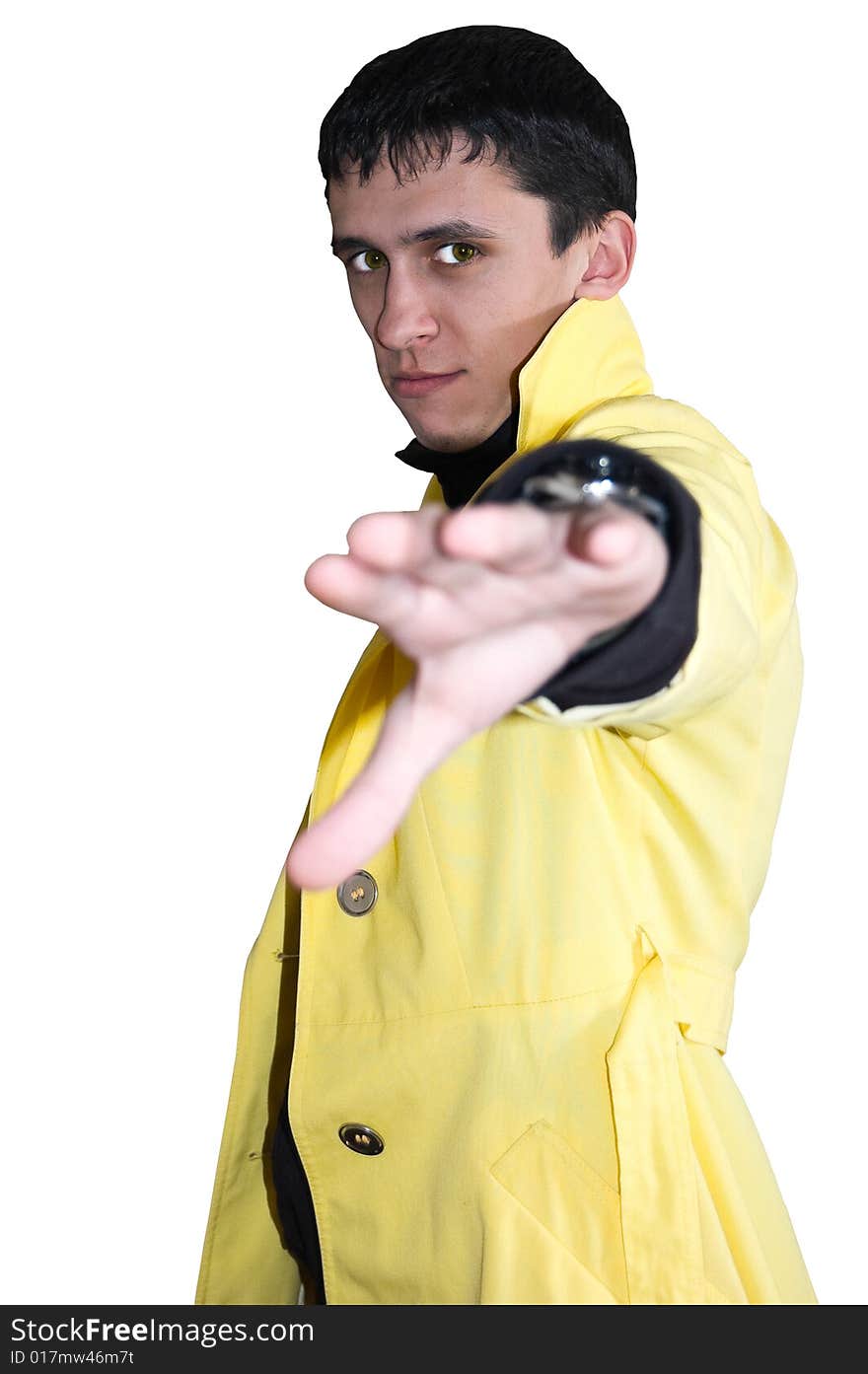 Young handsome man In a yellow raincoat, isolated on white, selective focus