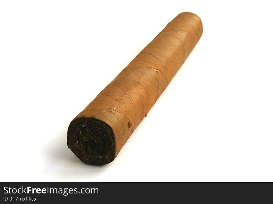 Hand rolled cigar on a white background