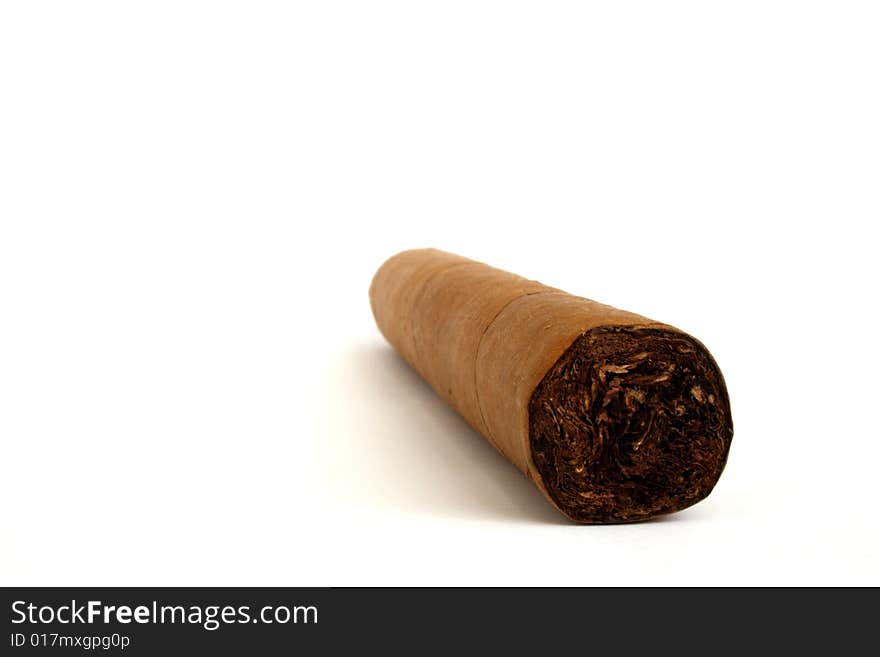 Hand rolled cigar on a white background