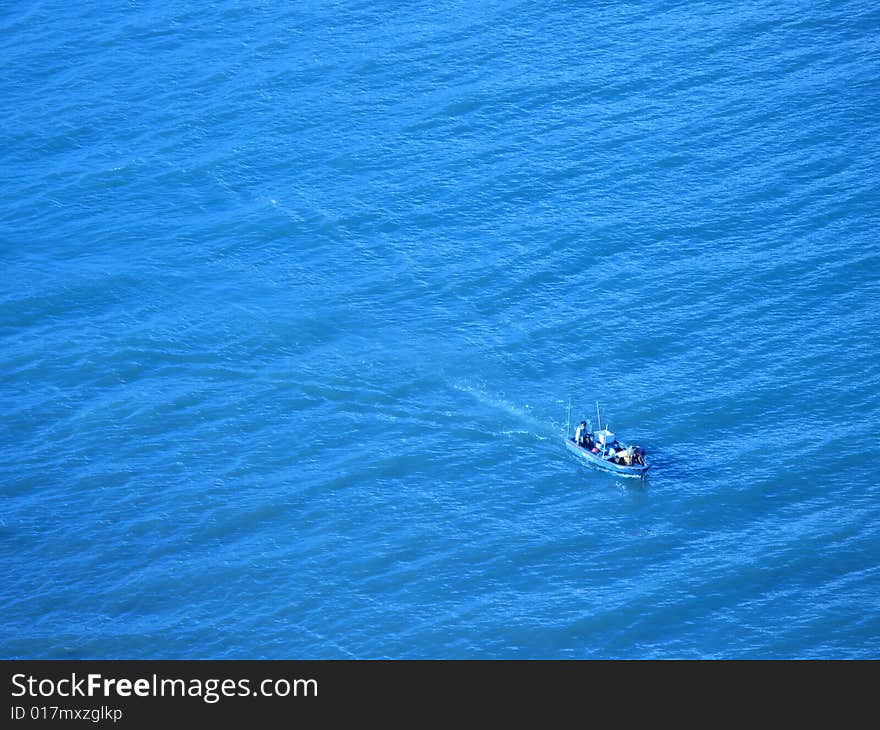 Fishing boat in the big blue sea. Fishing boat in the big blue sea.