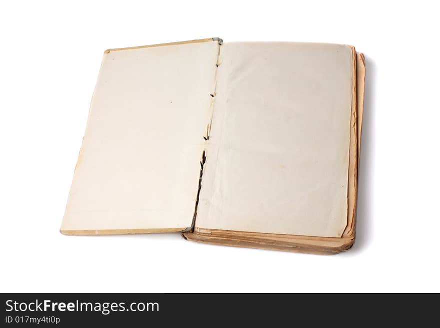 Opened old book on white