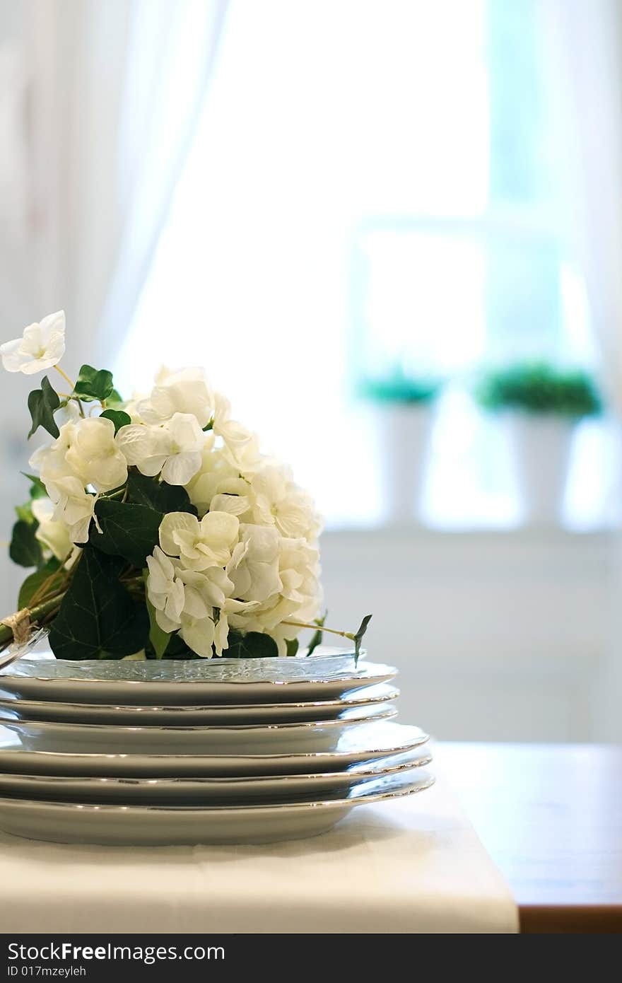 Beautiful dishware with flower in the room.