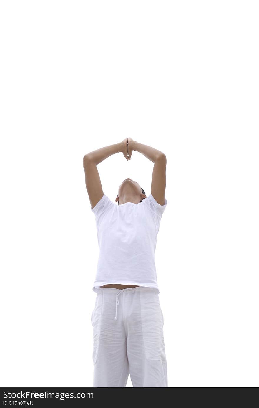 A young man practicing yoga outdoors. A young man practicing yoga outdoors