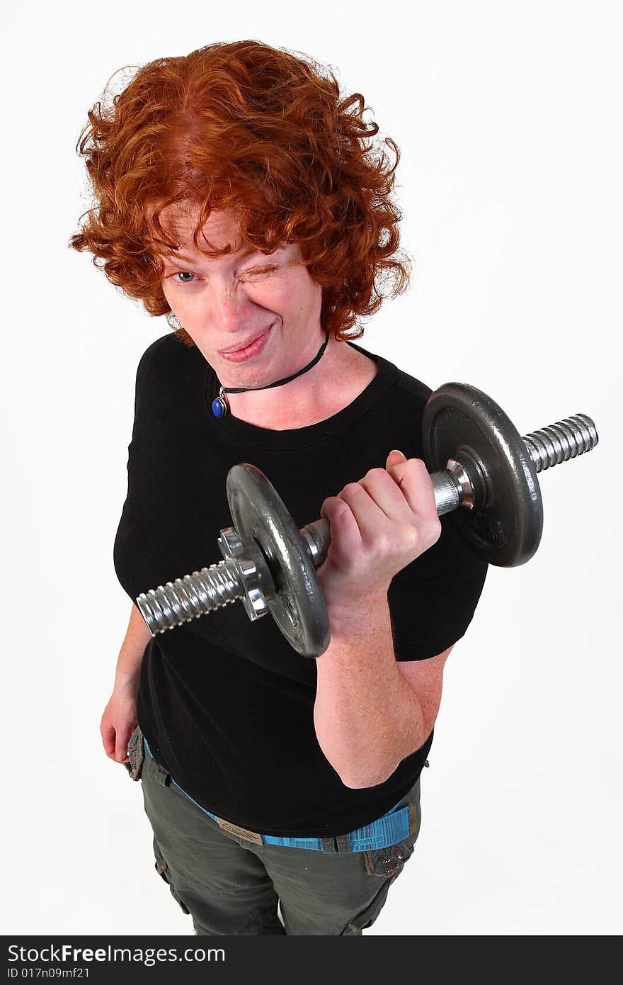 Red head woman lifting weight isolated on white. Red head woman lifting weight isolated on white