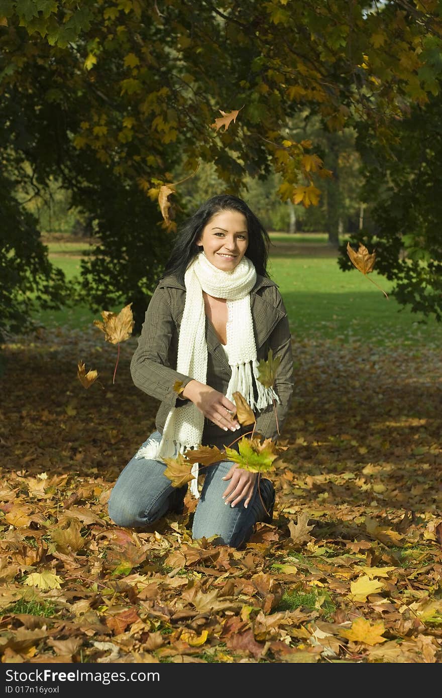 Woman playing with leaves outdoor. Woman playing with leaves outdoor